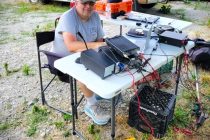 ham radio operator at field day portable station