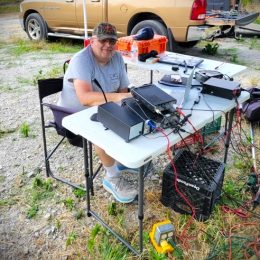 ham radio operator at field day portable station