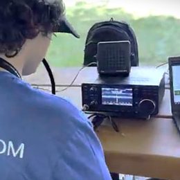 young ham radio operator at outdoor portable station