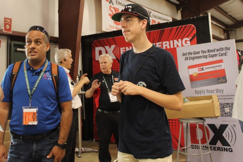 a pair of men at a trade show convention