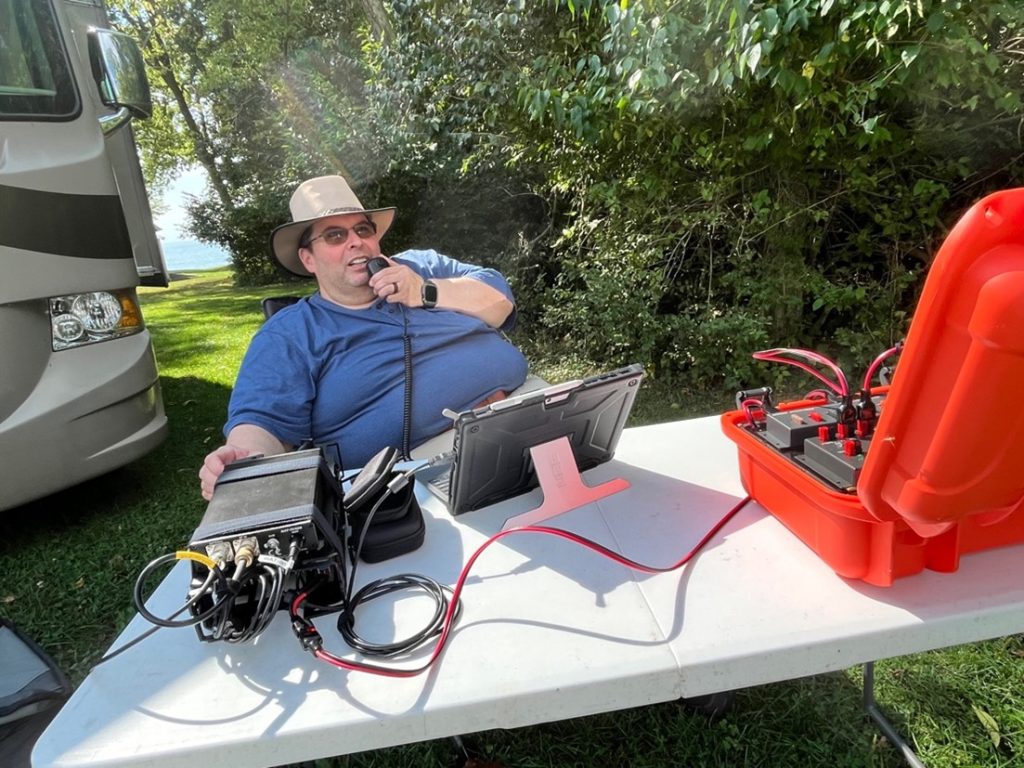 ham operator at a portable outdoor radio station