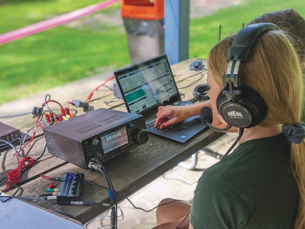Young Ham Operator at an outdoor portable radio station