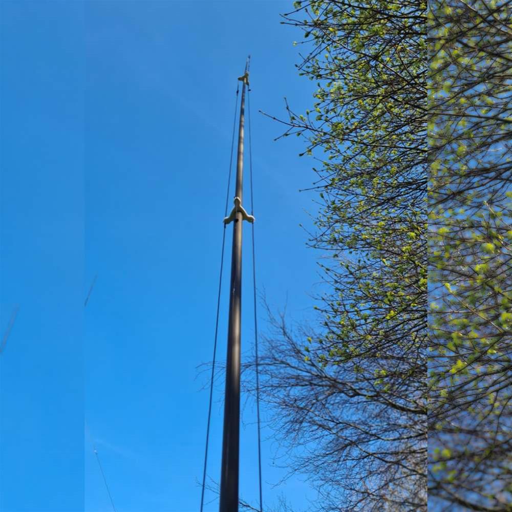 large portable vertical antenna mast in the air