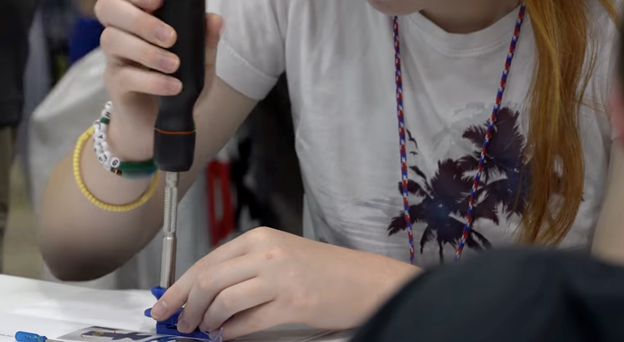 young woman using a screwdriver