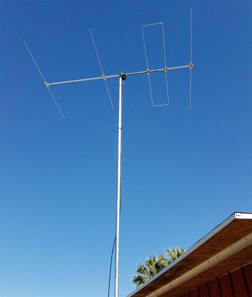 small yagi antenna over a residential roof