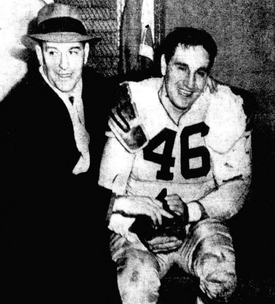 a vintage photograph of a football player & coach