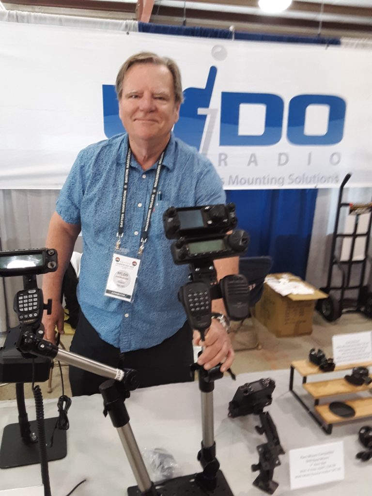 man at a trade show table display