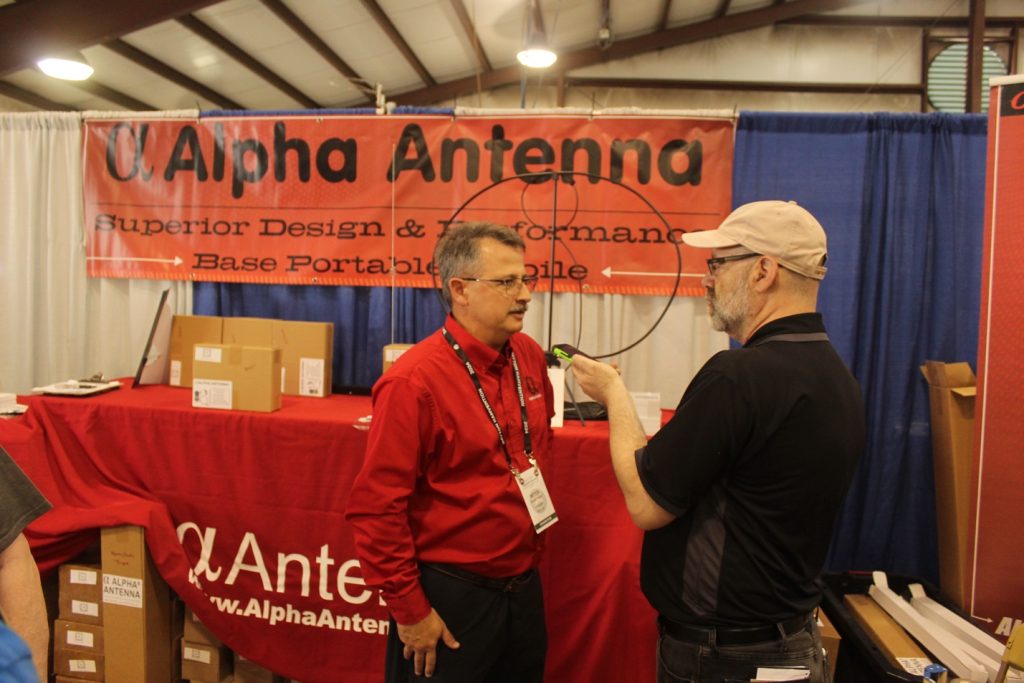 man being interviewed at a trade show display