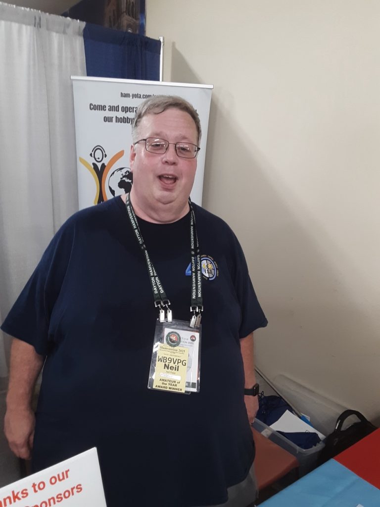 man at a trade show booth