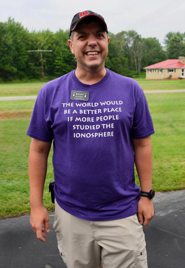 man posing for a photo outside