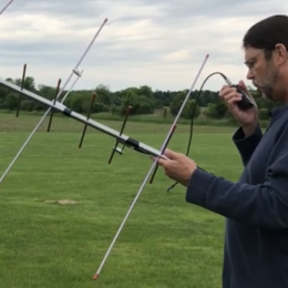 man holding a portable yagi antenna