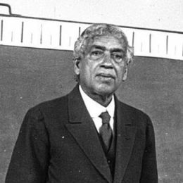 vintage photo of a man in front of a chalkboard