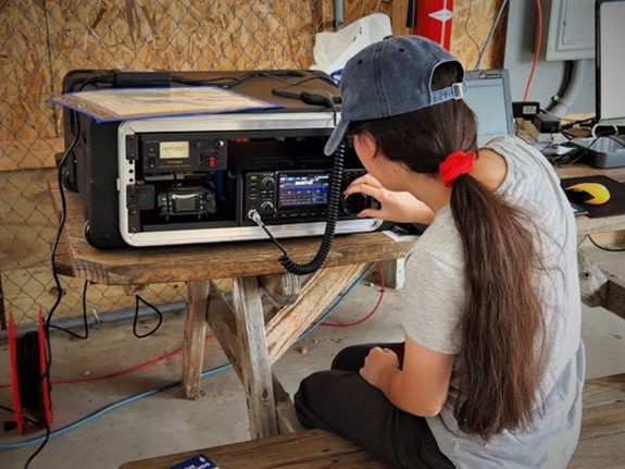 young ham radio operator using a go kit