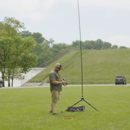 Man installing a larger portable vertical antenna