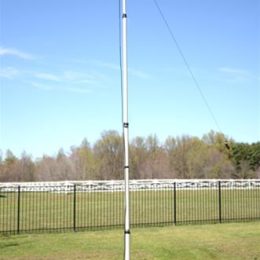 vertical ham radio antenna erected in field
