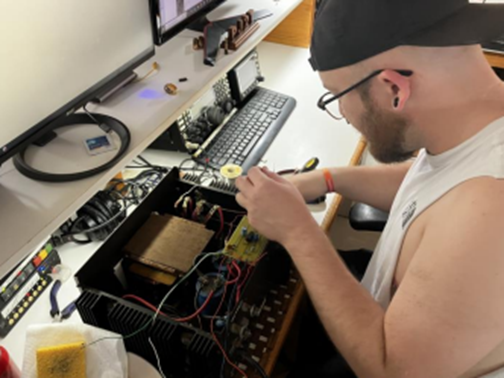 ham radio operator repairing a radio