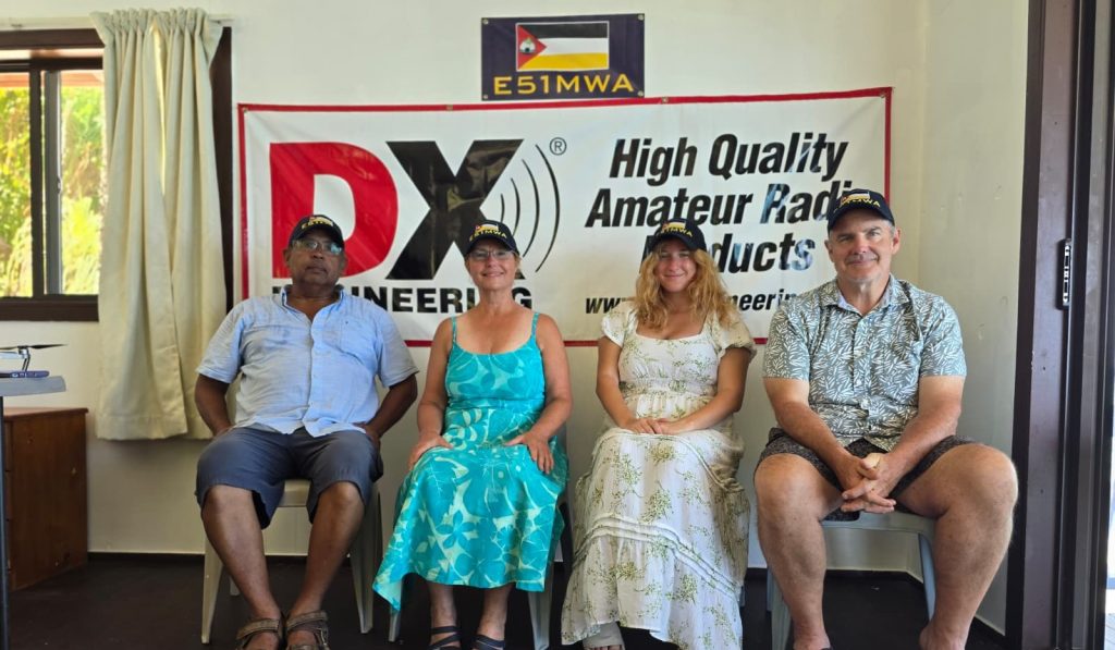 four people sitting in chairs