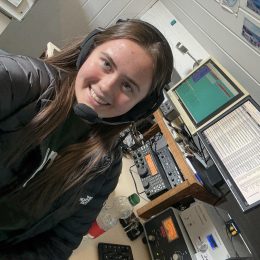 Young ham radio operator at station controls
