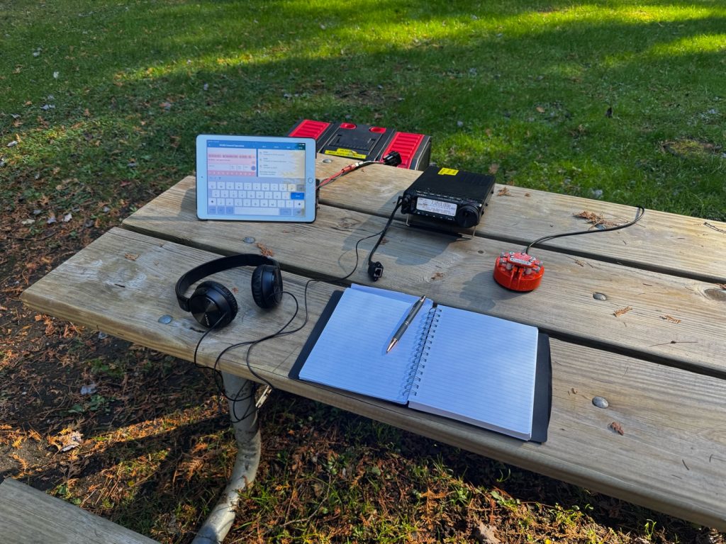 portable ham radio station on a park bench