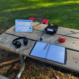 portable ham radio station on a park bench